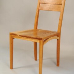 wood chair with arched leg support