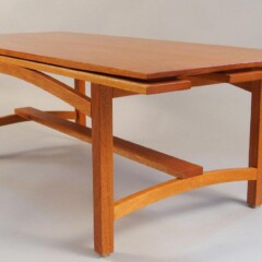 wood table with arched leg supports
