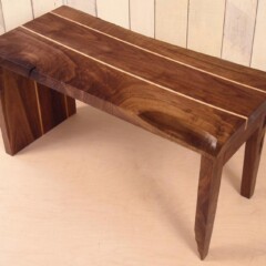 small dark wood bench with light wood inlaid lines